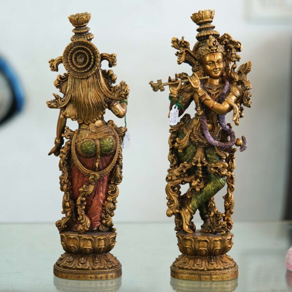 Set of two handcrafted brass statues inspired by Radha Krishna—elegant decorative couple showpiece for home décor and gifting. Set of two handcrafted brass statues inspired by Radha Krishna—elegant decorative couple showpiece for home décor and gifting.
