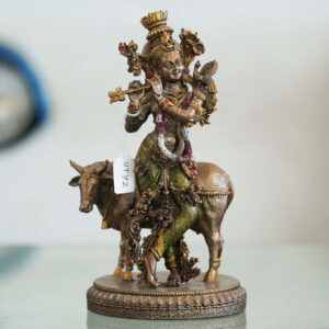 Brass Krishna with cow idol—flute playing Lord Krishna symbolizing love, purity, and harmony, ideal for home décor and gifting.