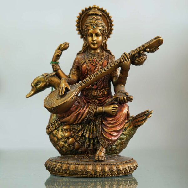 Saraswati Maa idol seated on a swan playing veena—symbol of knowledge, music, and wisdom, perfect for home décor and gifting.