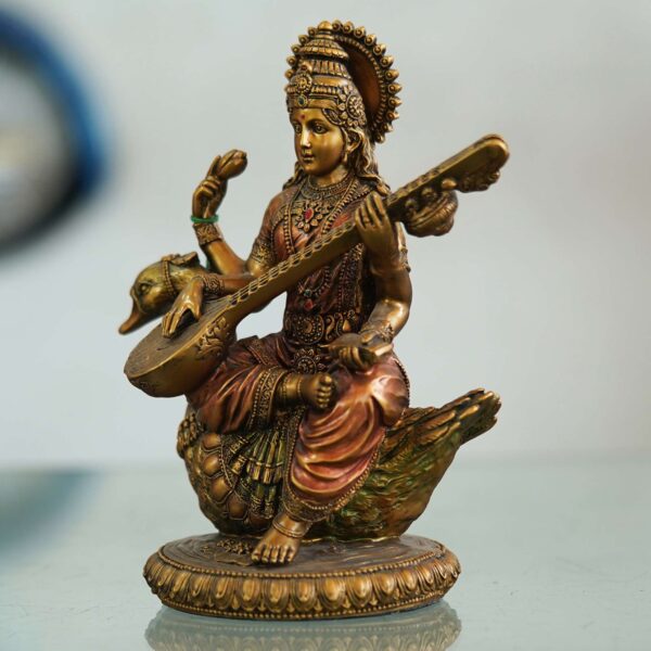 Saraswati Maa idol seated on a swan playing veena—symbol of knowledge, music, and wisdom, perfect for home décor and gifting.