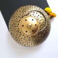 Elegant brass incense burner with a top opening for sticks and wide base for ashes—perfect for meditation, pooja, and home décor.