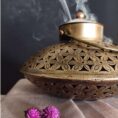 Elegant brass incense burner with a top opening for sticks and wide base for ashes—perfect for meditation, pooja, and home décor.